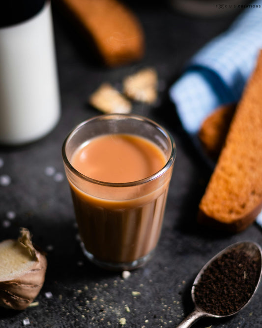 A clear glass of Chai Tea. 