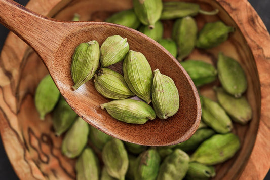 A bowl filled with cardamom.